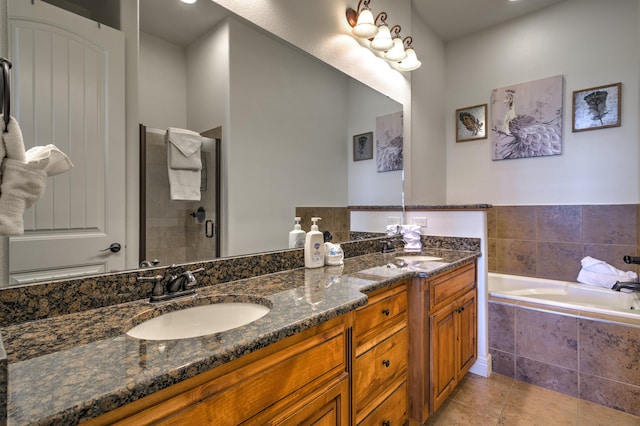 bathroom featuring vanity, plus walk in shower, and tile patterned flooring