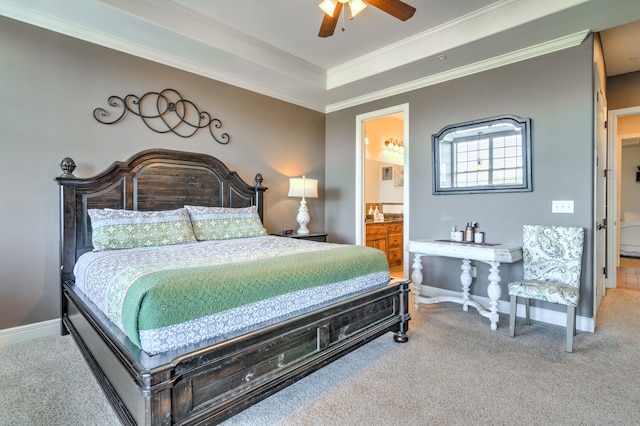 carpeted bedroom featuring ornamental molding, ensuite bathroom, and ceiling fan