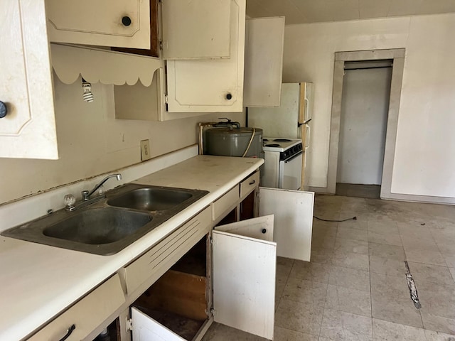 kitchen with white electric stove and sink