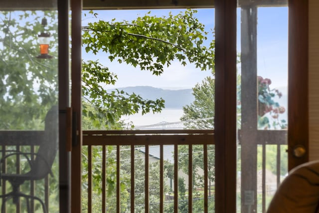 balcony with a water and mountain view