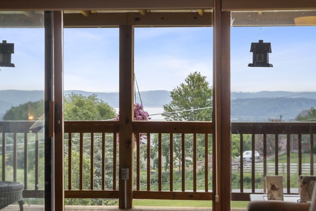 sunroom featuring a mountain view