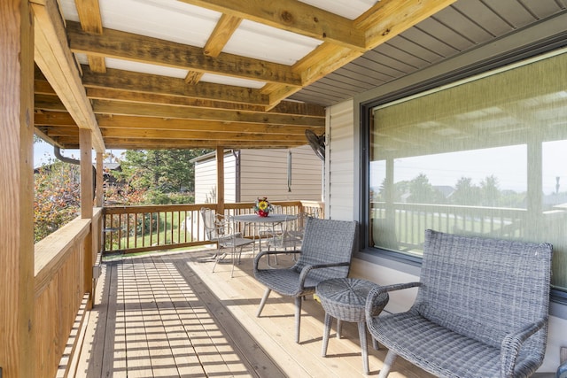 wooden terrace featuring outdoor dining space