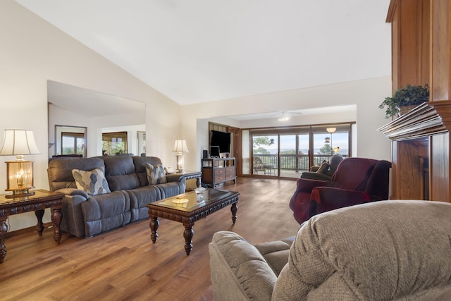 living room with high vaulted ceiling, a ceiling fan, and wood finished floors