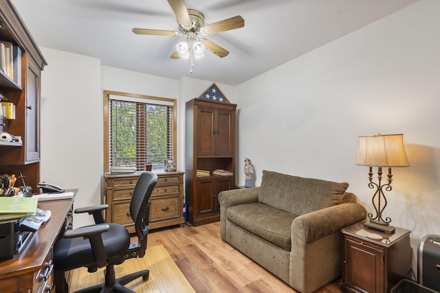 home office with a ceiling fan and light wood-style floors