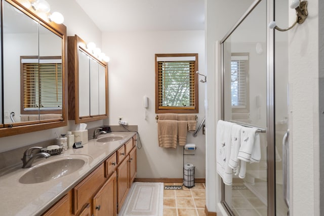 bathroom with a shower stall and a sink