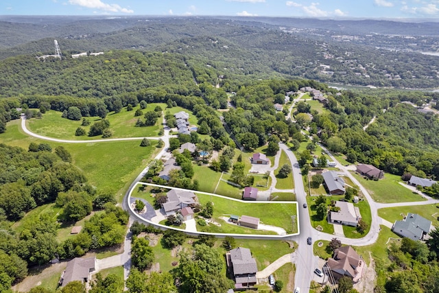 drone / aerial view with a view of trees and a residential view