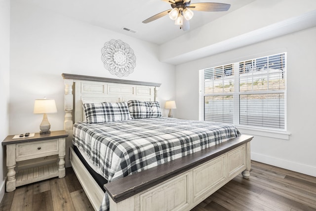 bedroom with ceiling fan and dark wood-type flooring