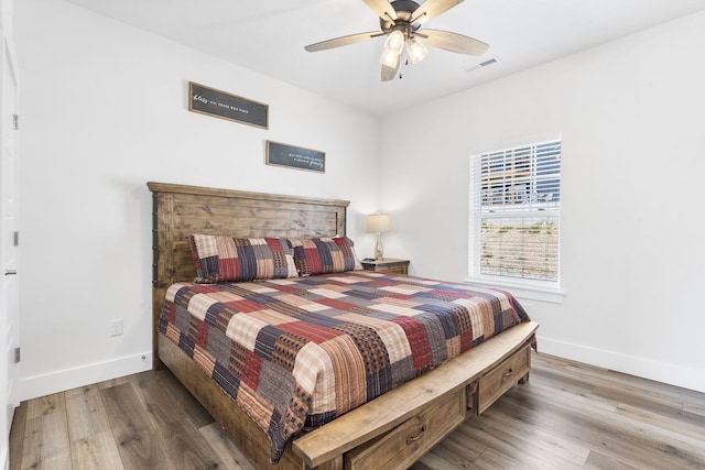 bedroom featuring ceiling fan and hardwood / wood-style floors