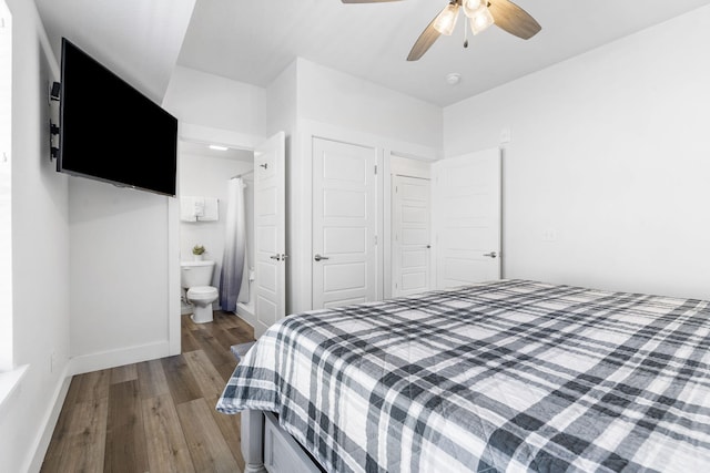 bedroom featuring ensuite bathroom, ceiling fan, a closet, and hardwood / wood-style floors