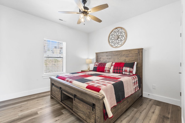 bedroom with ceiling fan and light wood-type flooring