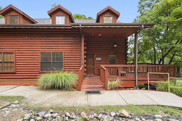 log cabin with a deck