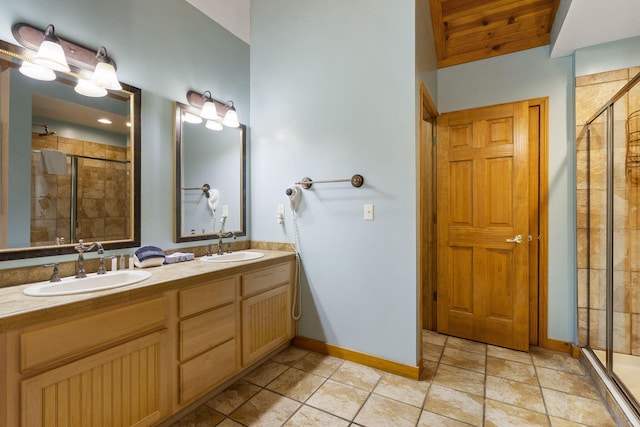 bathroom featuring vanity and a shower with shower door