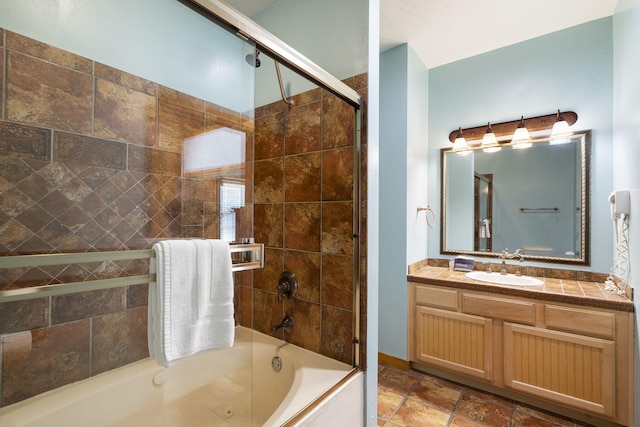 bathroom with enclosed tub / shower combo and vanity