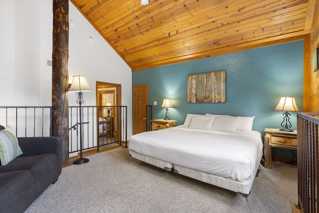 carpeted bedroom with wood ceiling and high vaulted ceiling