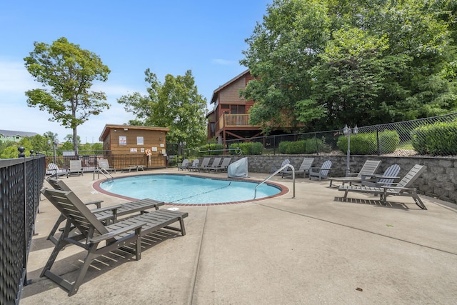 view of pool featuring a patio area