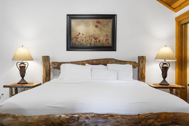 bedroom featuring vaulted ceiling