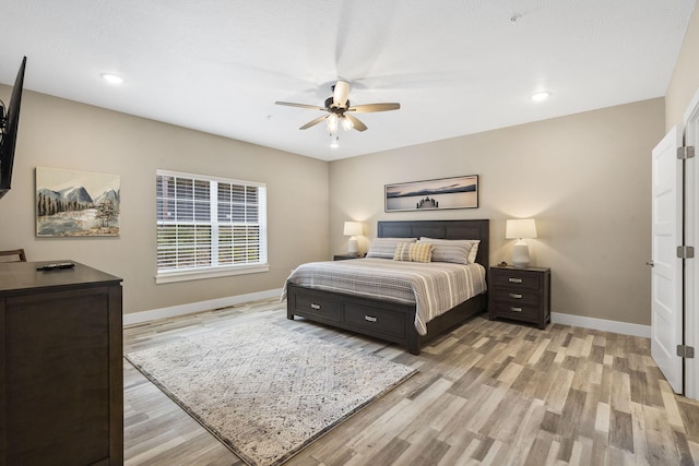 bedroom featuring recessed lighting, light wood finished floors, and baseboards