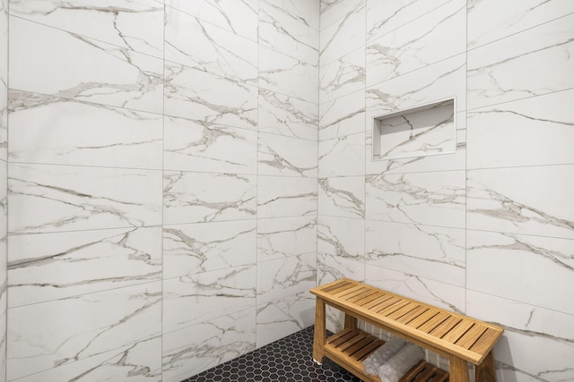 bathroom with tiled shower