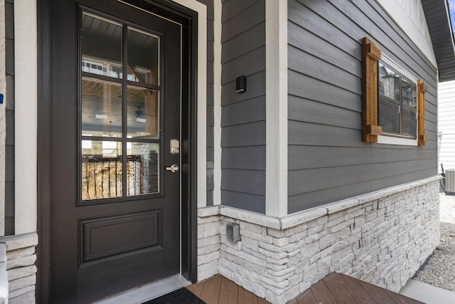 view of exterior entry featuring central AC