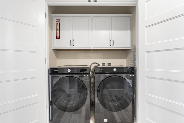 laundry area featuring cabinet space and washing machine and dryer