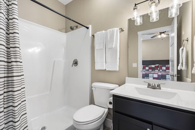 bathroom featuring a shower with curtain, connected bathroom, vanity, and toilet
