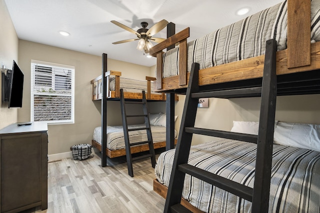 bedroom with light wood-type flooring and ceiling fan