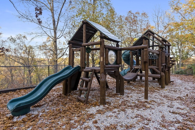 community jungle gym featuring fence