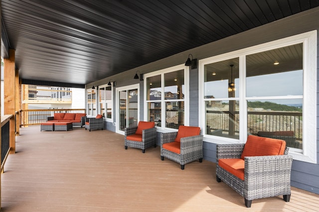 deck with an outdoor hangout area