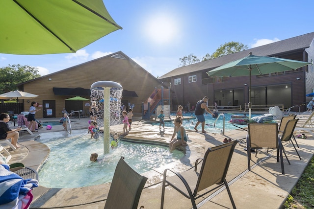 view of pool featuring a patio and pool water feature