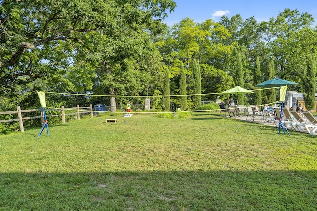 surrounding community featuring a playground and a lawn