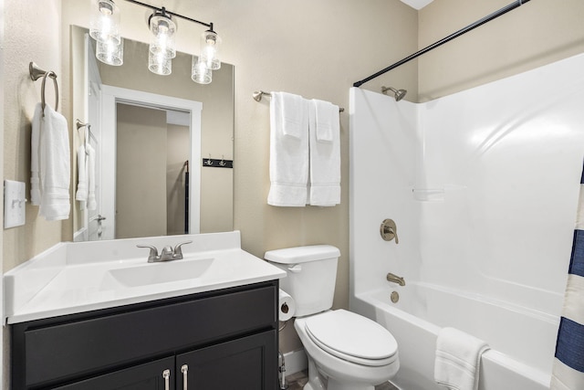bathroom featuring shower / bath combination, vanity, and toilet