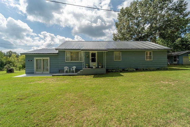 822 County Road 160, Fremont, MO 63941 - back of property with a lawn, a patio area, and metal roof