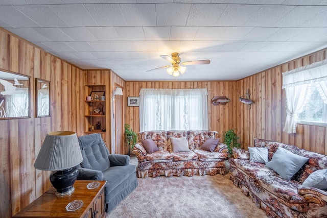822 County Road 160, Fremont, MO 63941 - carpeted living room with a ceiling fan, a healthy amount of sunlight, and wooden walls