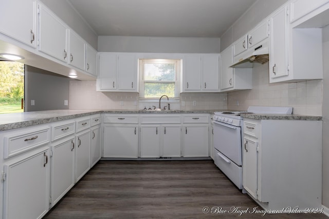 kitchen with under cabinet range hood, white range with electric cooktop, and white cabinetry