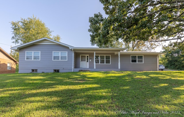 single story home featuring a front lawn and a porch