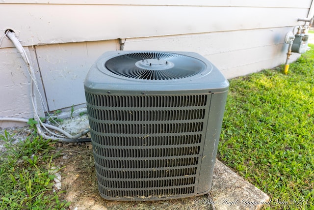 exterior details with cooling unit and gas meter