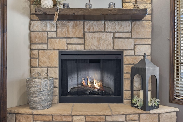 details with a stone fireplace