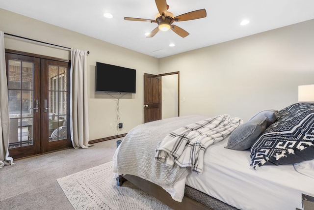 carpeted bedroom with access to exterior, ceiling fan, and french doors