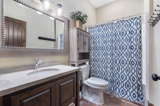 bathroom featuring vanity, a shower with curtain, and toilet