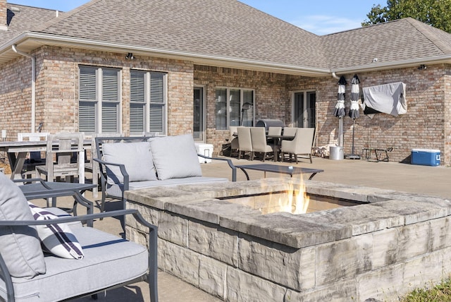 view of patio with a fire pit