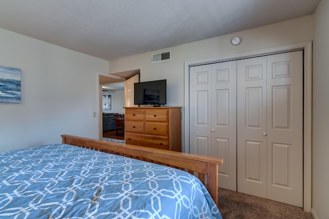 carpeted bedroom with a closet