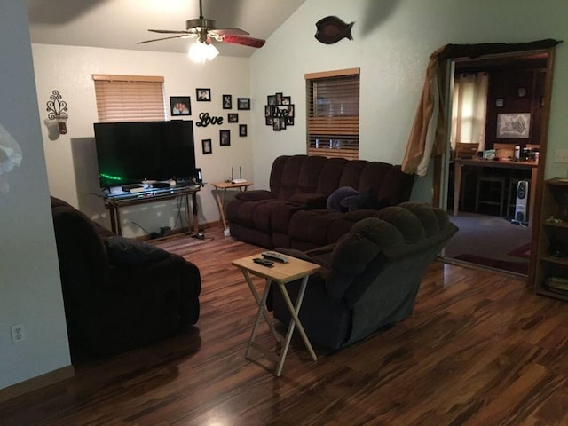 living room with ceiling fan, lofted ceiling, and wood-type flooring