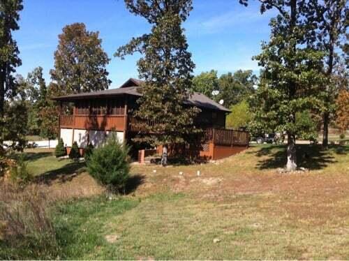 26020 Sharon Ln, Warsaw, MO 65355 - view of side of home featuring a yard and a deck