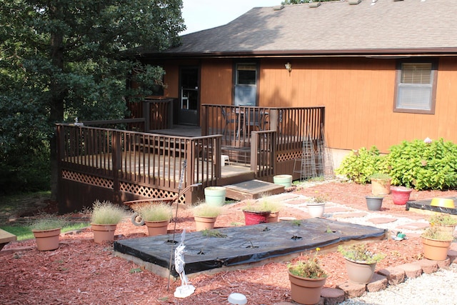 26020 Sharon Ln, Warsaw, MO 65355 - back of house featuring a wooden deck and a shingled roof