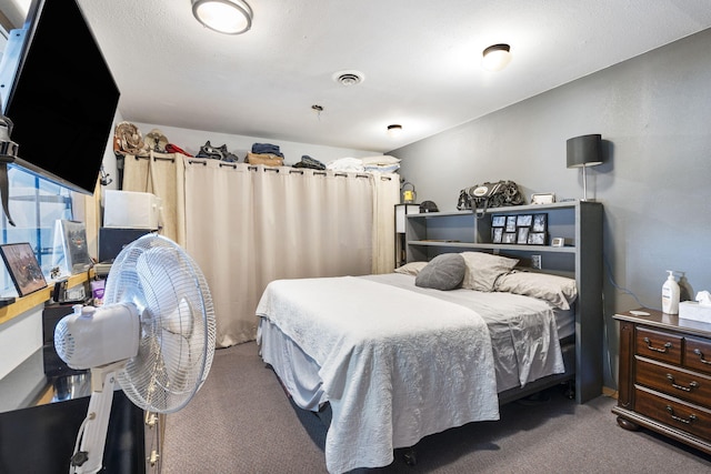 bedroom featuring dark colored carpet