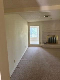 unfurnished living room with carpet flooring