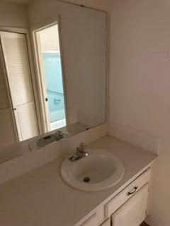 bathroom with plenty of natural light and vanity