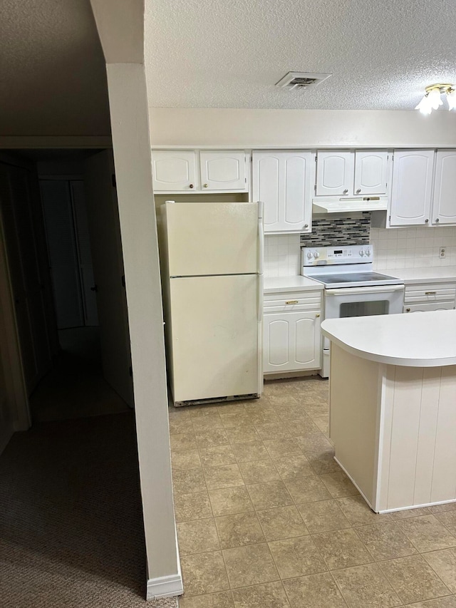 kitchen featuring backsplash, light tile patterned floors, white appliances, and white cabinetry