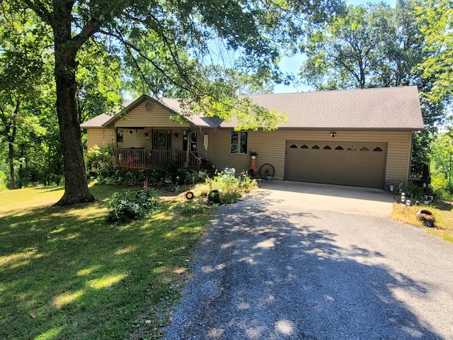1201 Railey Creek Rd, Reeds Spring, MO 65737 - ranch-style house with a garage, driveway, a front lawn, and covered porch