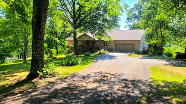 view of front of property featuring a garage and a front yard